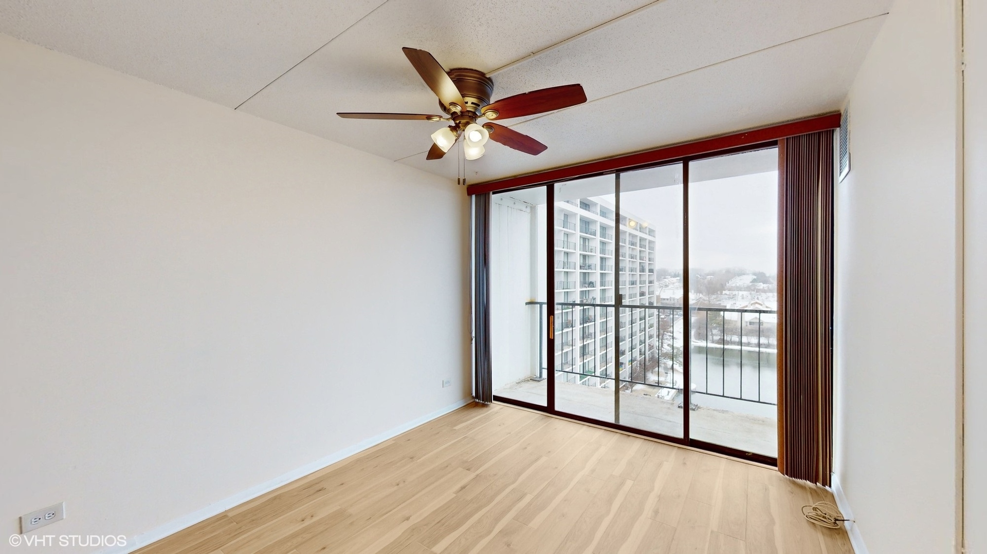 2005 South Finley Road, Unit 805 Lombard, IL 60148 - Photo 23 of 34 a view of a big room with wooden floor and windows