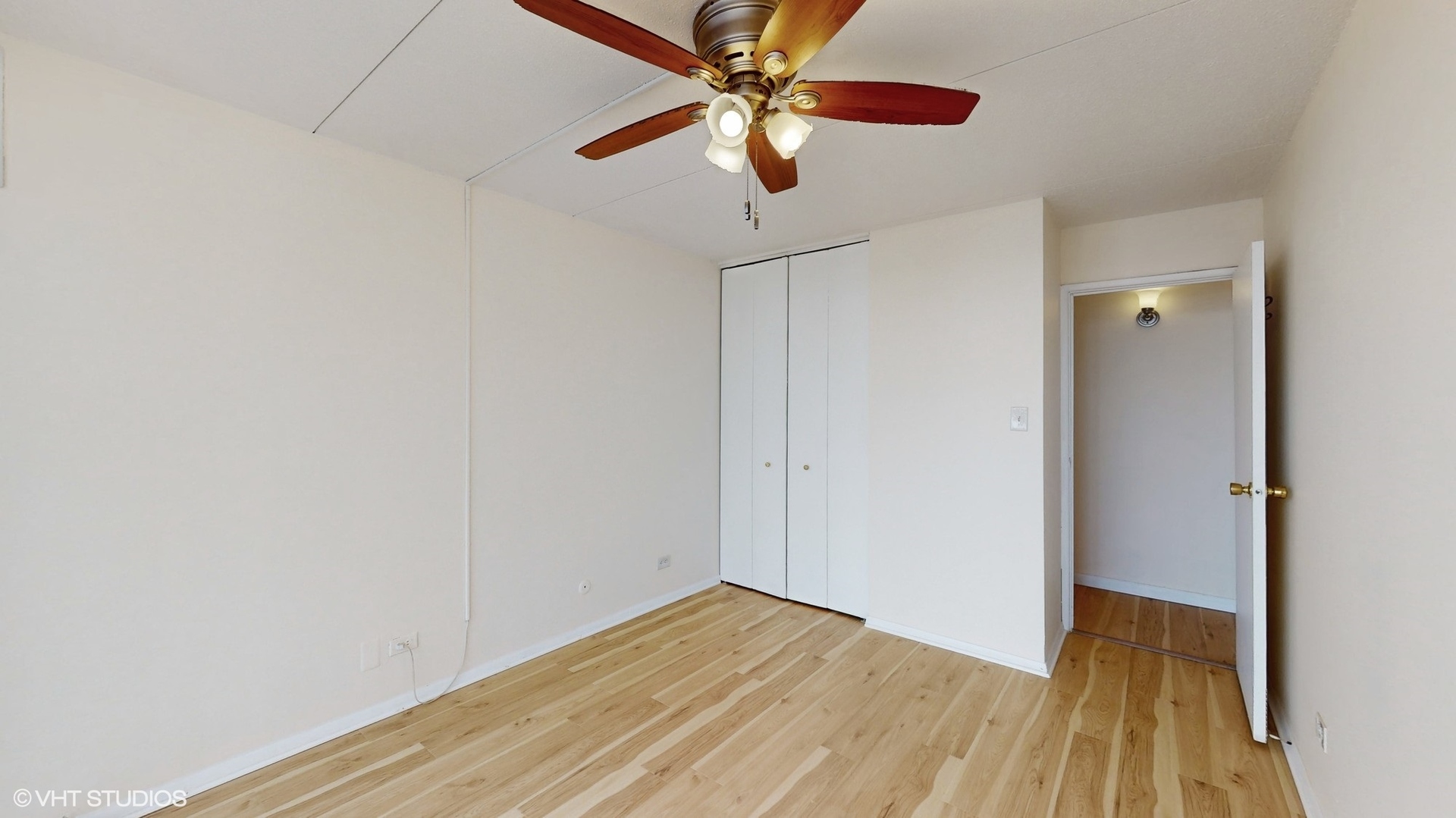 2005 South Finley Road, Unit 805 Lombard, IL 60148 - Photo 25 of 34 a view of a room with wooden floor a ceiling fan and a ceiling fan