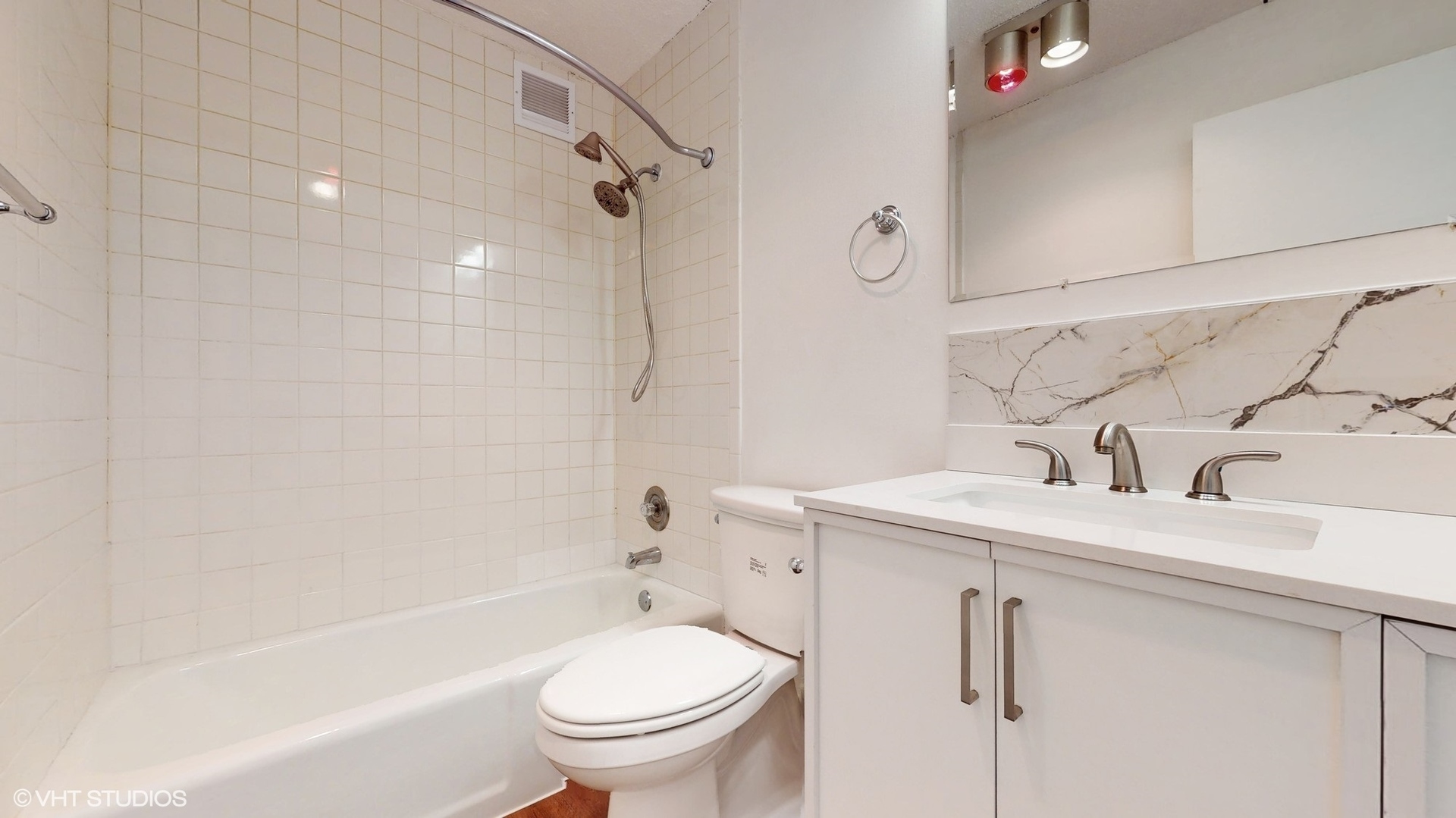 2005 South Finley Road, Unit 805 Lombard, IL 60148 - Photo 26 of 34 a bathroom with a sink toilet and shower