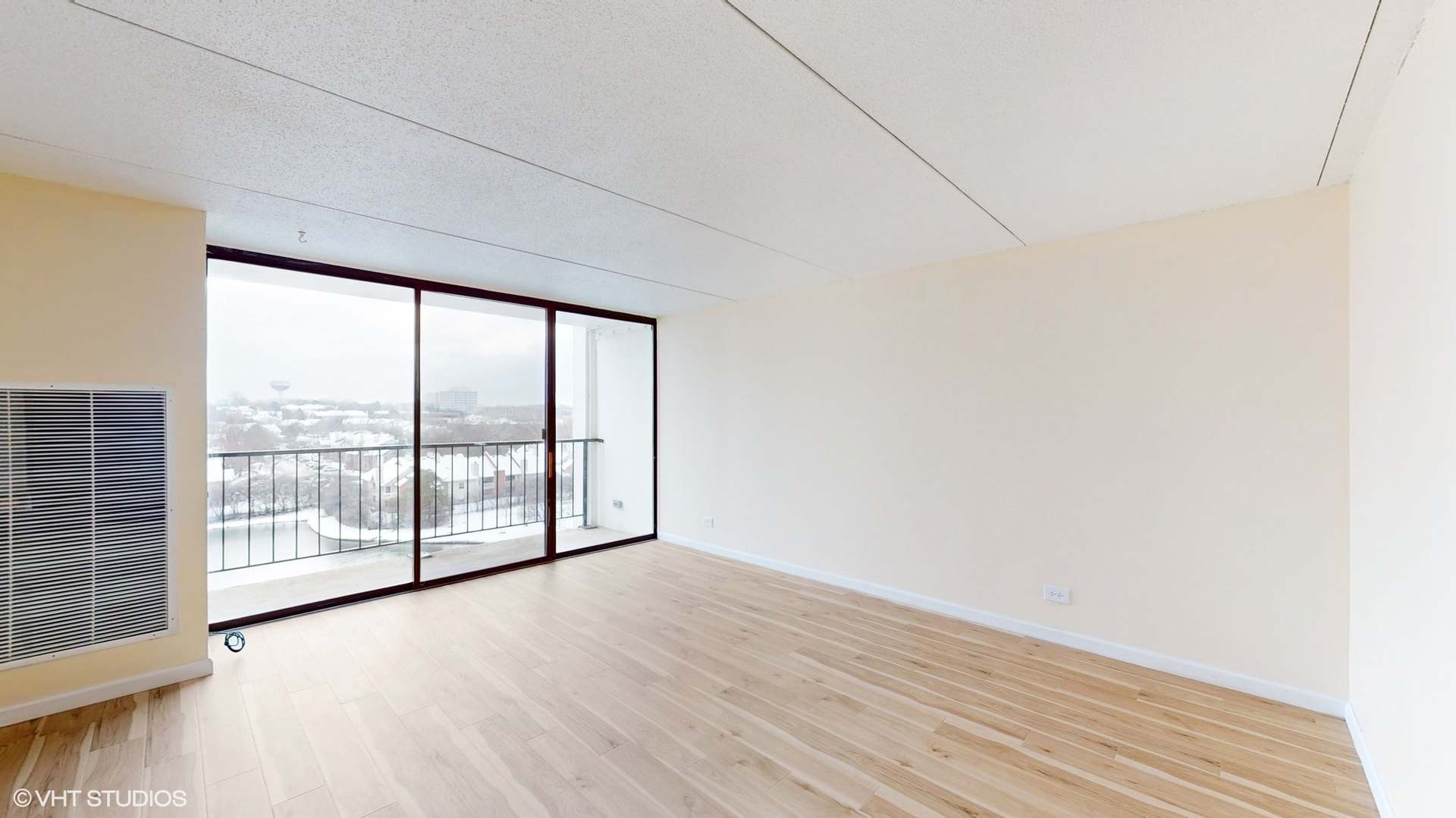 2005 South Finley Road, Unit 805 Lombard, IL 60148 - Photo 4 of 34 an empty room with wooden floor and windows