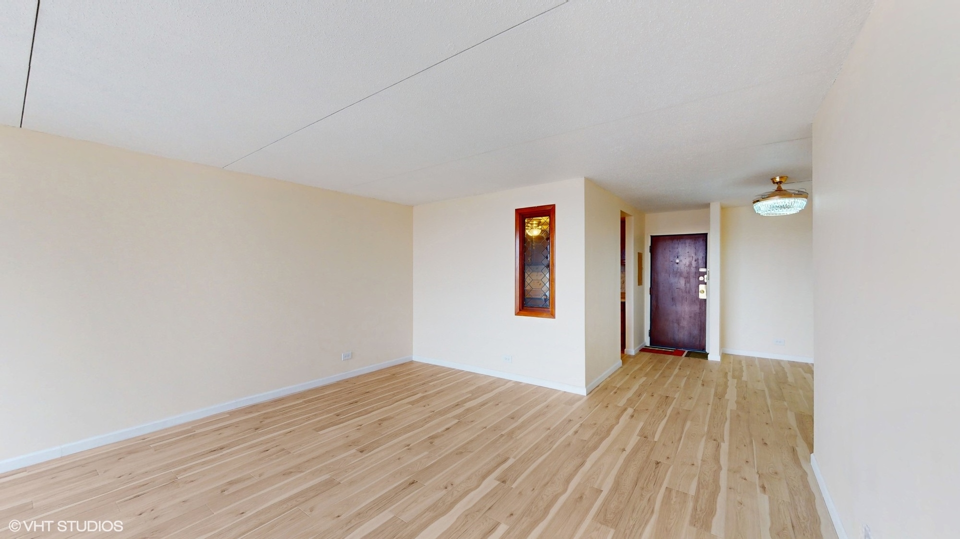 2005 South Finley Road, Unit 805 Lombard, IL 60148 - Photo 6 of 34 a view of livingroom with window and wooden floor