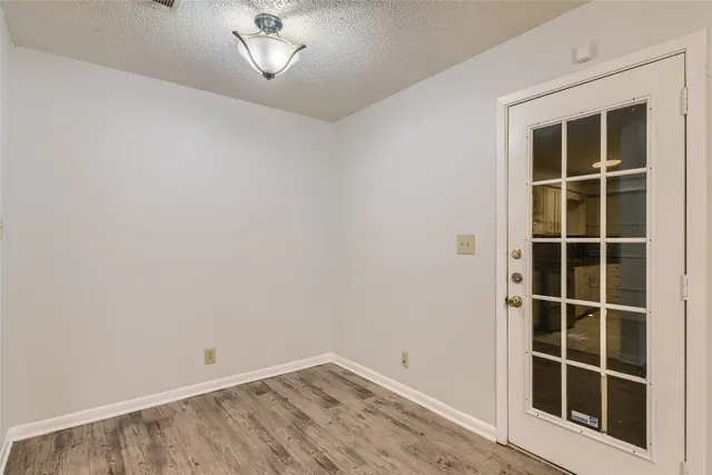 a view of empty room with windows