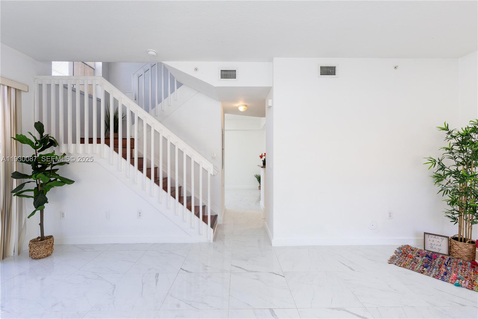 1009 Southwest 144th Avenue, Unit 2701 Pembroke Pines, FL 33027 - Photo 2 of 36 a view of entryway with a potted plant