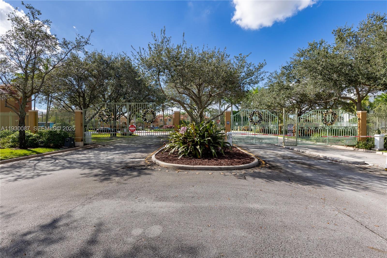 1009 Southwest 144th Avenue, Unit 2701 Pembroke Pines, FL 33027 - Photo 26 of 36 a view of fountain in middle of forest