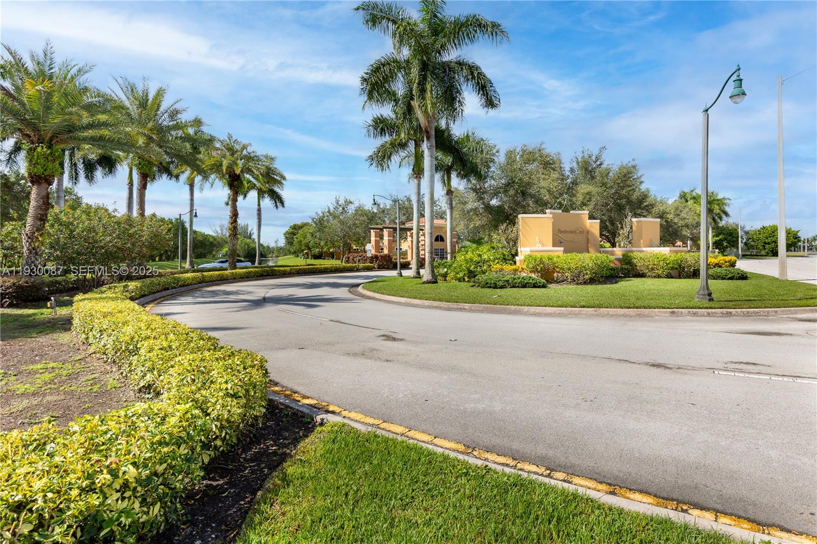 1009 Southwest 144th Avenue, Unit 2701 Pembroke Pines, FL 33027 - Photo 28 of 36 a view of a garden with palm trees