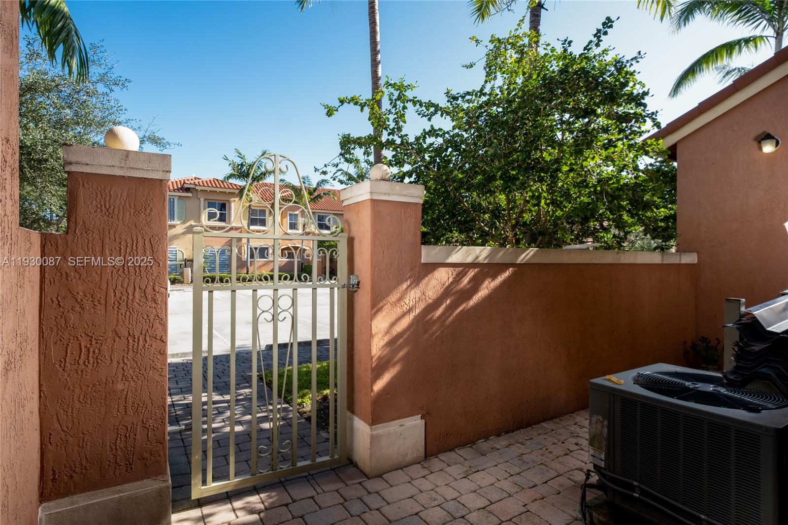 1009 Southwest 144th Avenue, Unit 2701 Pembroke Pines, FL 33027 - Photo 31 of 36 a backyard of a house with lots of green space