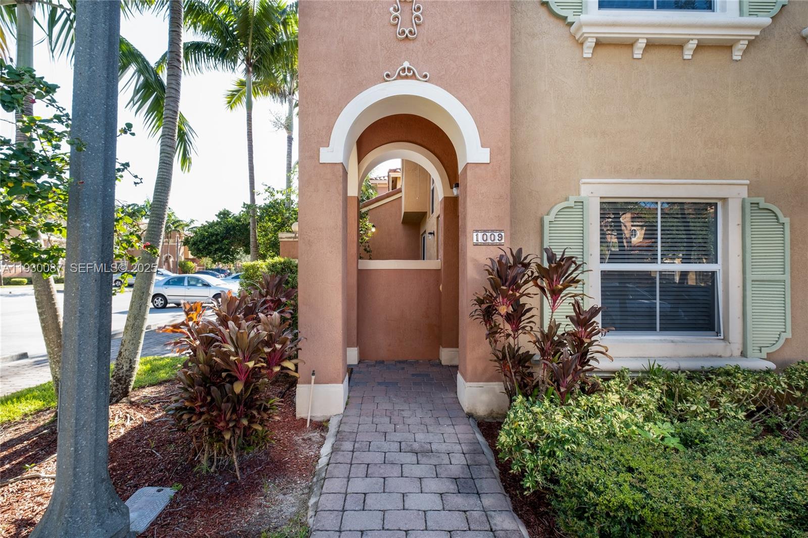 1009 Southwest 144th Avenue, Unit 2701 Pembroke Pines, FL 33027 - Photo 33 of 36 a front view of a house with garden