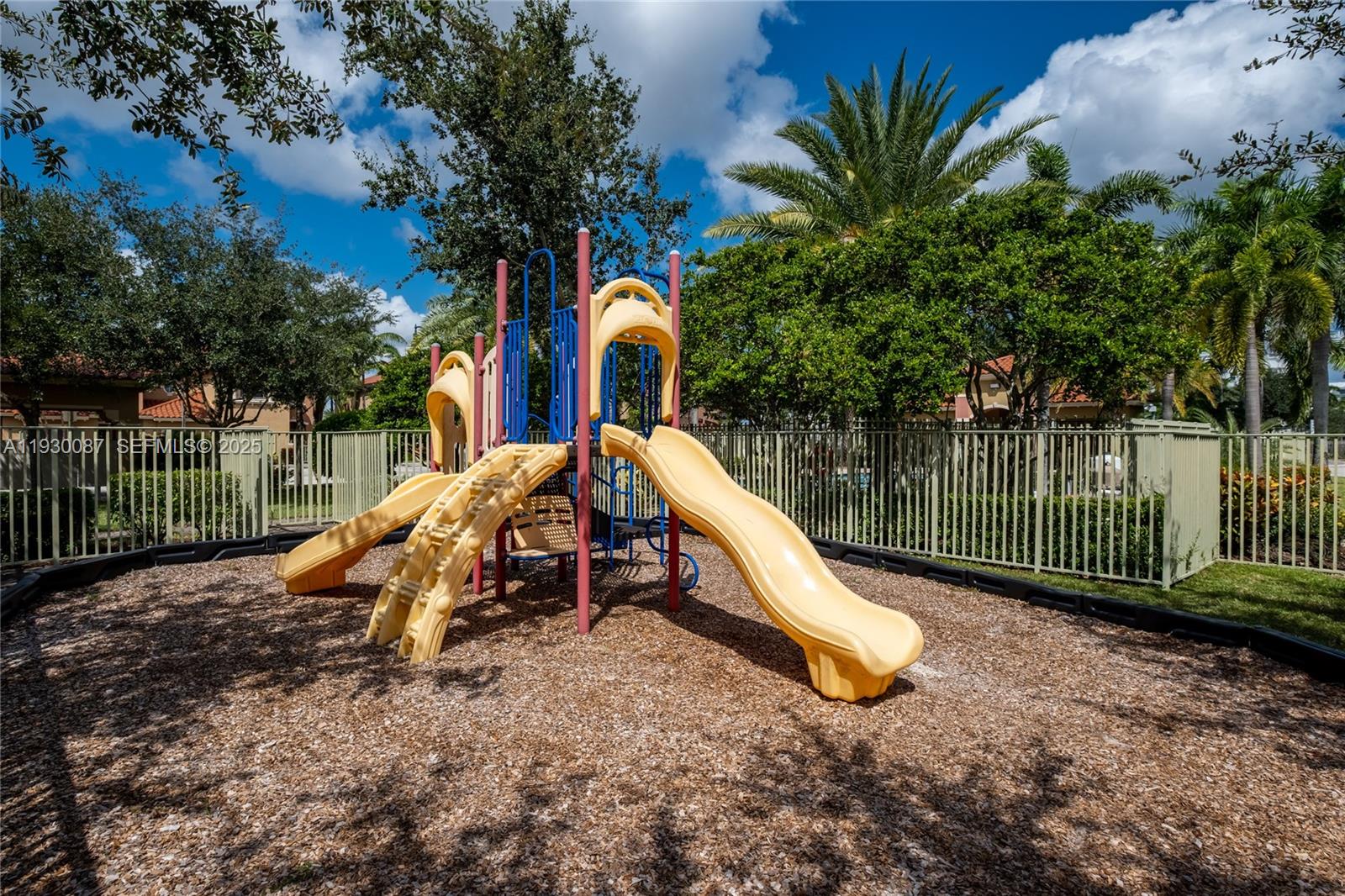 1009 Southwest 144th Avenue, Unit 2701 Pembroke Pines, FL 33027 - Photo 35 of 36 a view of a park with slide and a lake view