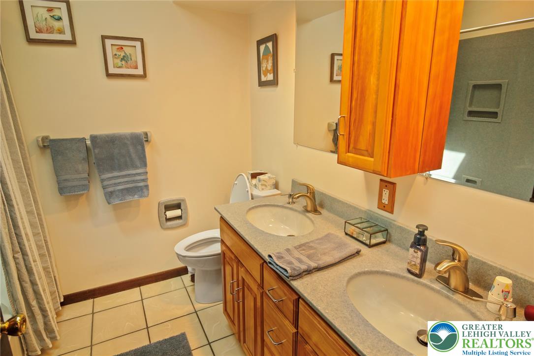 3470 Brodhead Road Bethlehem, PA 18020 - Photo 68 of 84 A well-lit bathroom provides twin sinks, ample counter space, and convenient storage options.