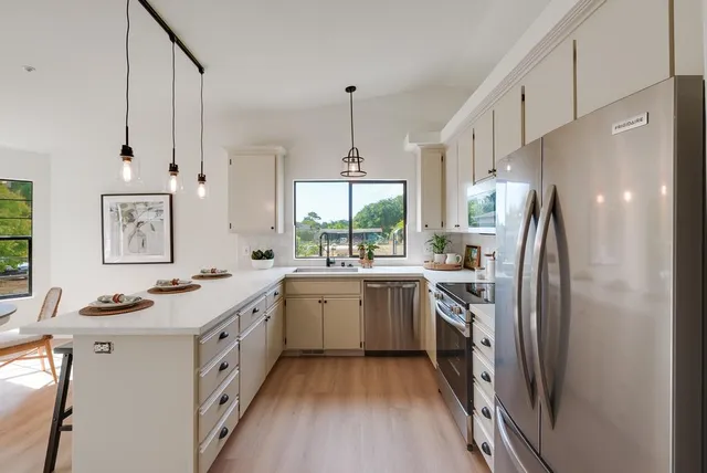 a kitchen with a sink and a window