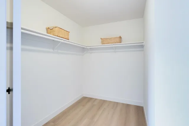 a bathroom with a double vanity sink mirror and toilet