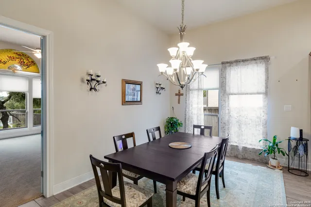 a view of a dining room with furniture window and outside view