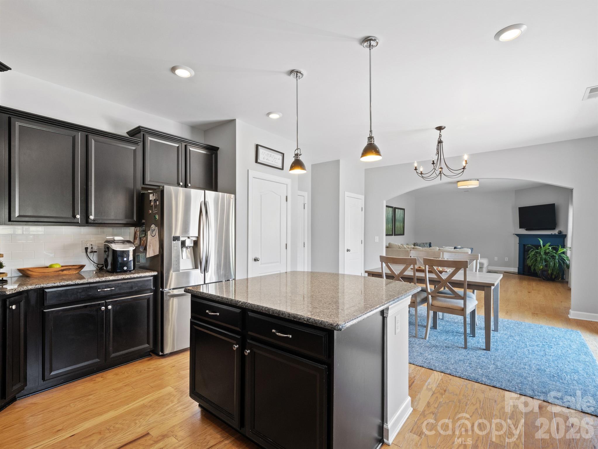 1982 Smokey Quartz Road Davidson, NC 28036 - Photo 11 of 43 a kitchen with stainless steel appliances granite countertop sink stove top oven and refrigerator