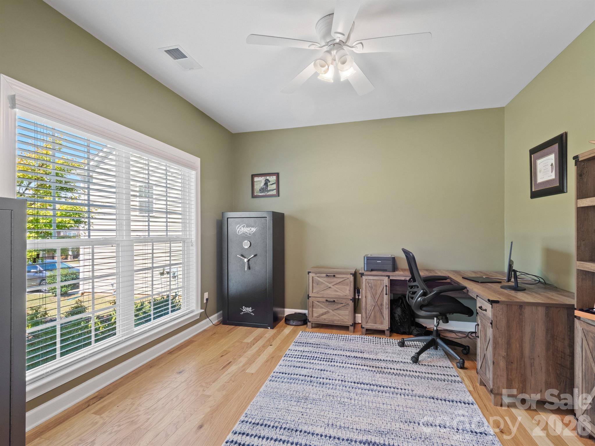 1982 Smokey Quartz Road Davidson, NC 28036 - Photo 13 of 43 a workspace with wooden floor and a window