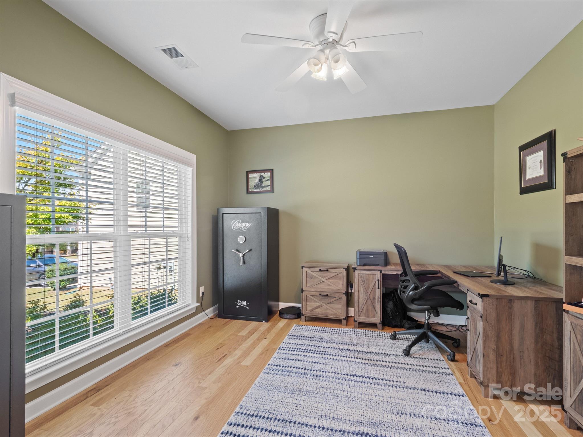 1982 Smokey Quartz Road Davidson, NC 28036 - Photo 13 of 43 a workspace with wooden floor and a window