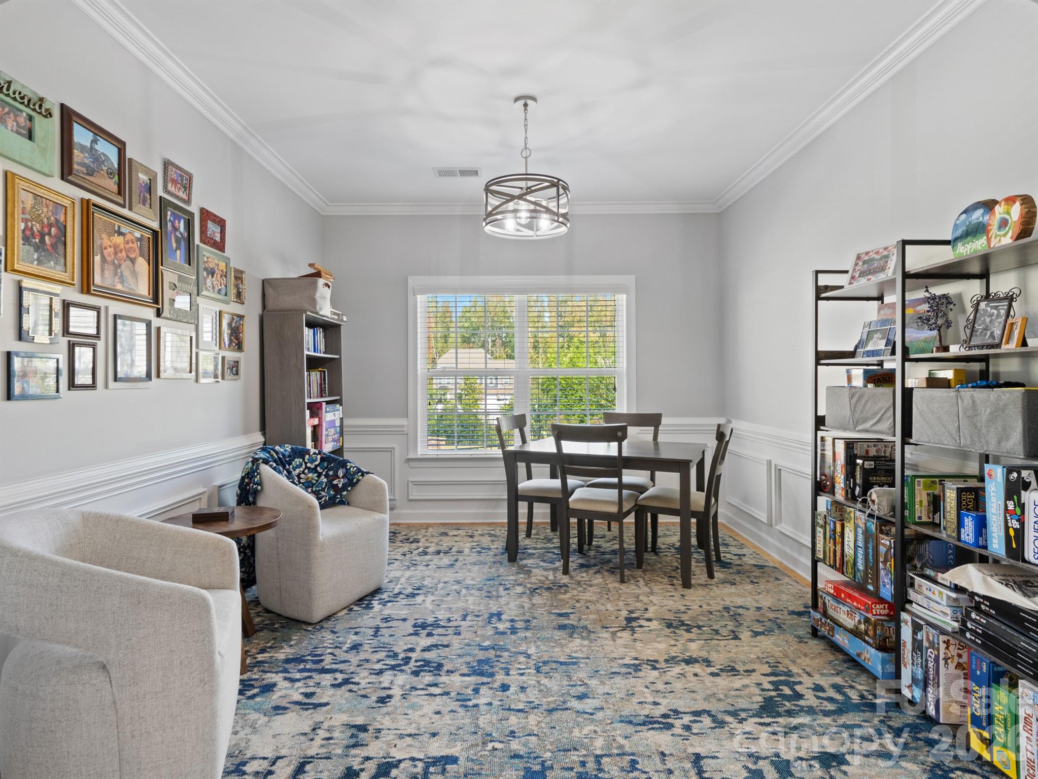 1982 Smokey Quartz Road Davidson, NC 28036 - Photo 14 of 43 a dining room with lots of furniture and a book shelf