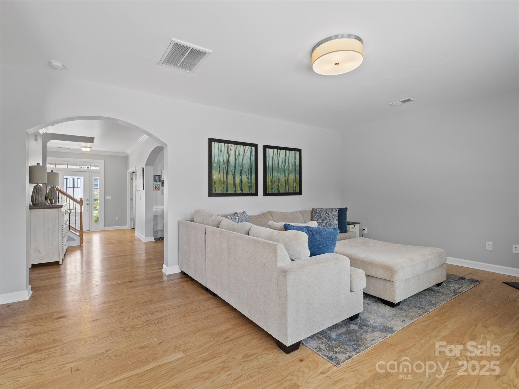 1982 Smokey Quartz Road Davidson, NC 28036 - Photo 17 of 43 a living room with couches and a flat screen tv