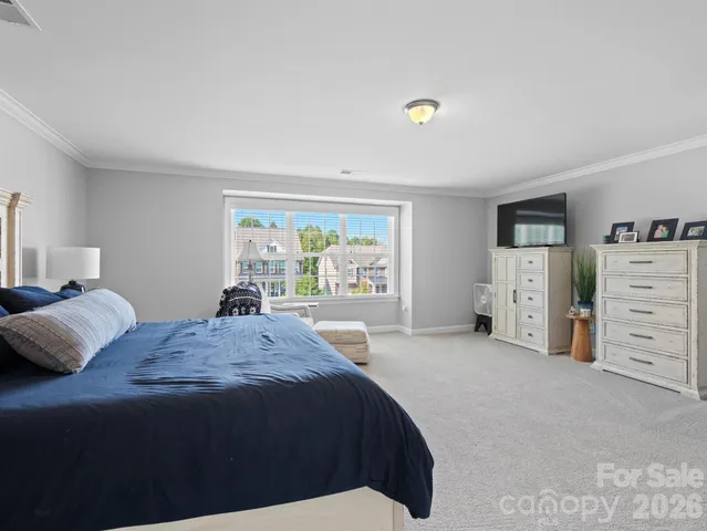 a bedroom with a bed and dresser