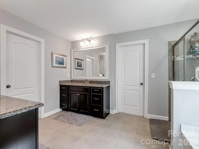 a room with a dresser and a mirror