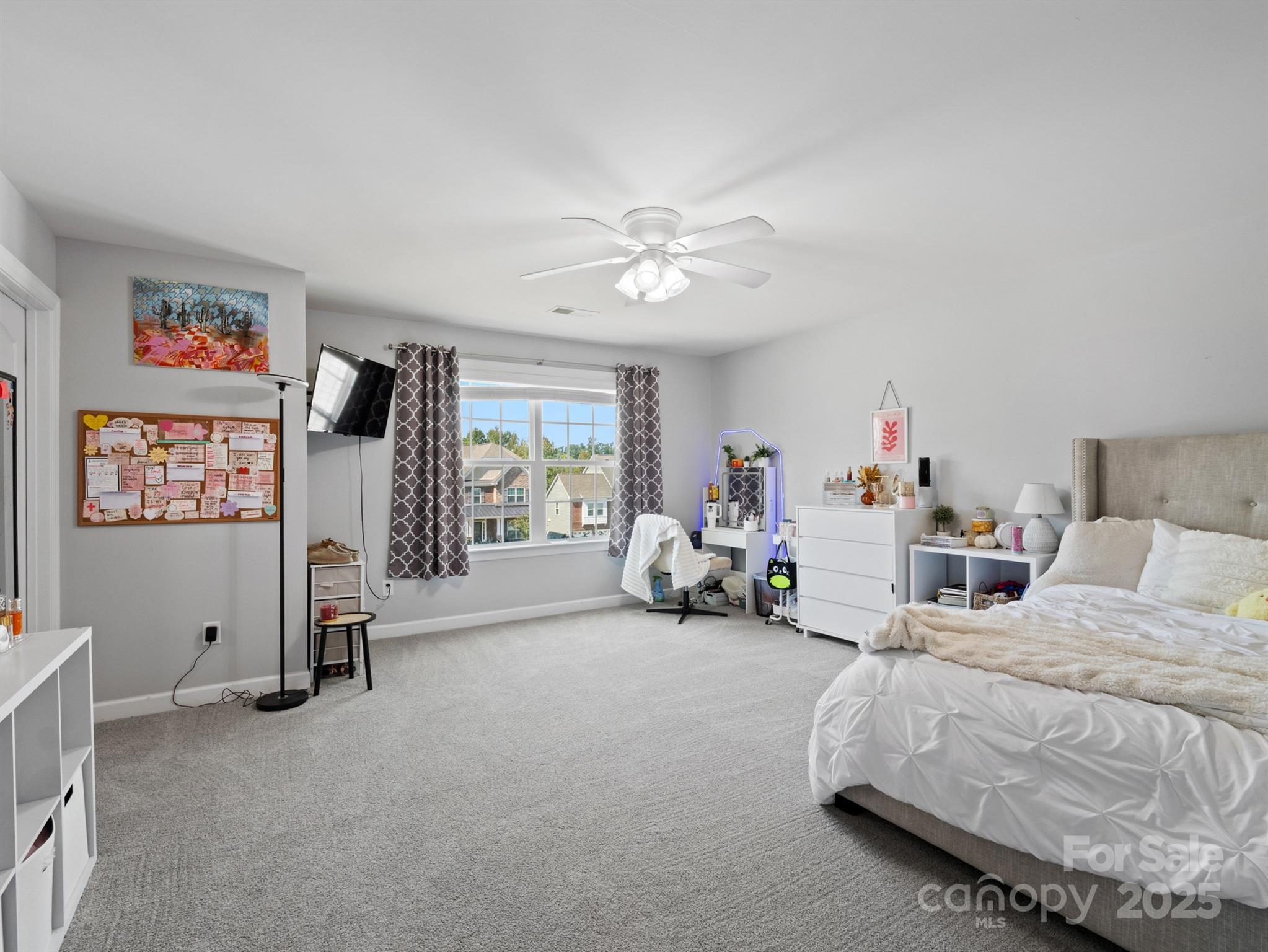 1982 Smokey Quartz Road Davidson, NC 28036 - Photo 27 of 43 a bedroom with furniture and a flat screen tv