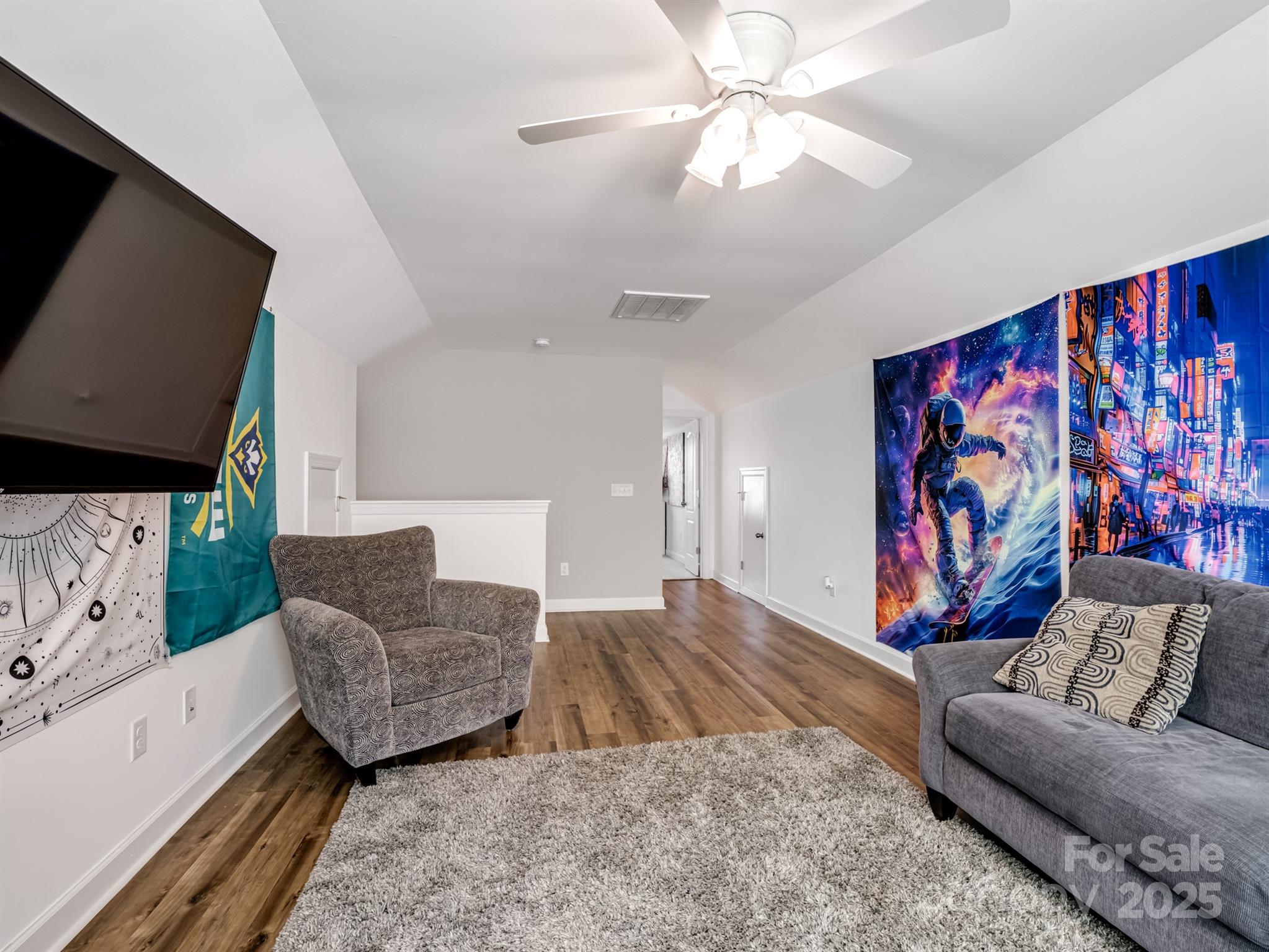 1982 Smokey Quartz Road Davidson, NC 28036 - Photo 35 of 43 a living room with furniture and a flat screen tv