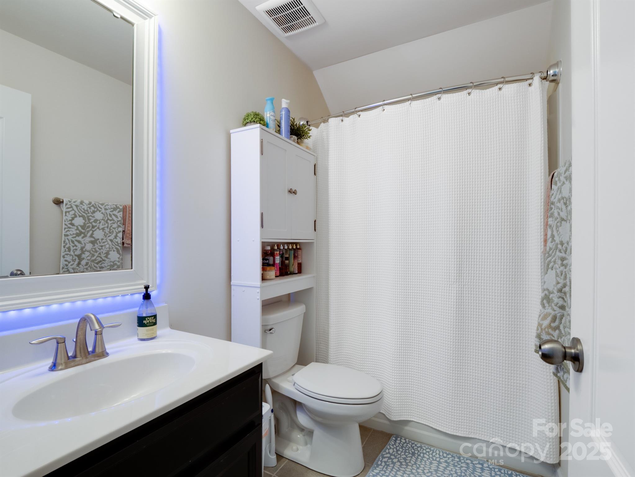 1982 Smokey Quartz Road Davidson, NC 28036 - Photo 37 of 43 a bathroom with a sink toilet and vanity