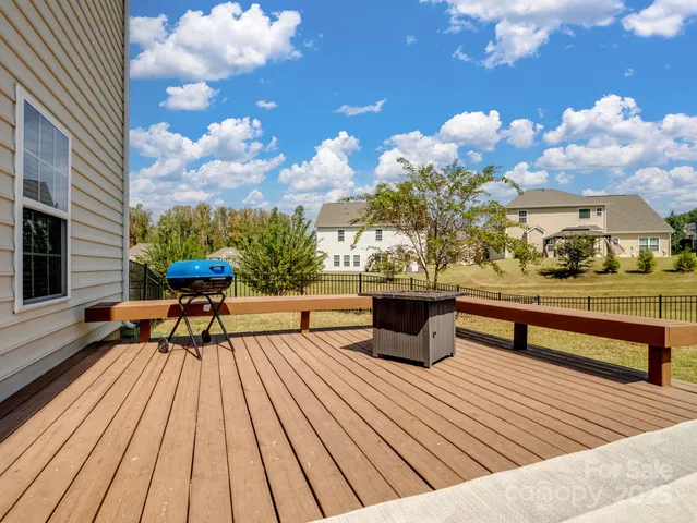 a view of a patio with wooden floor