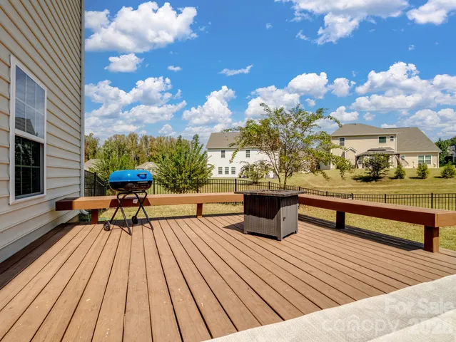 a view of a patio with wooden floor