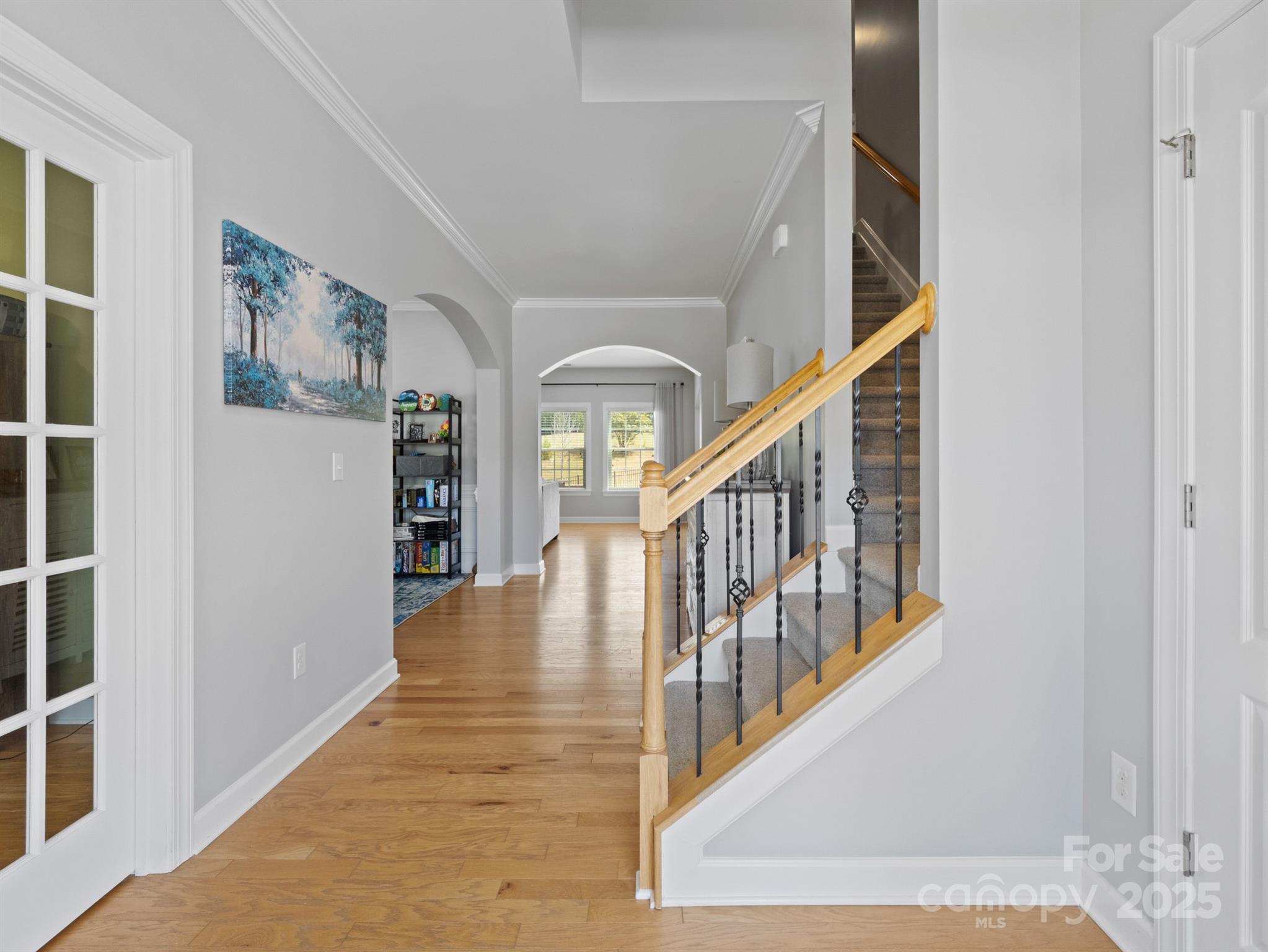 1982 Smokey Quartz Road Davidson, NC 28036 - Photo 5 of 43 a view of an entryway with wooden floor and a front door
