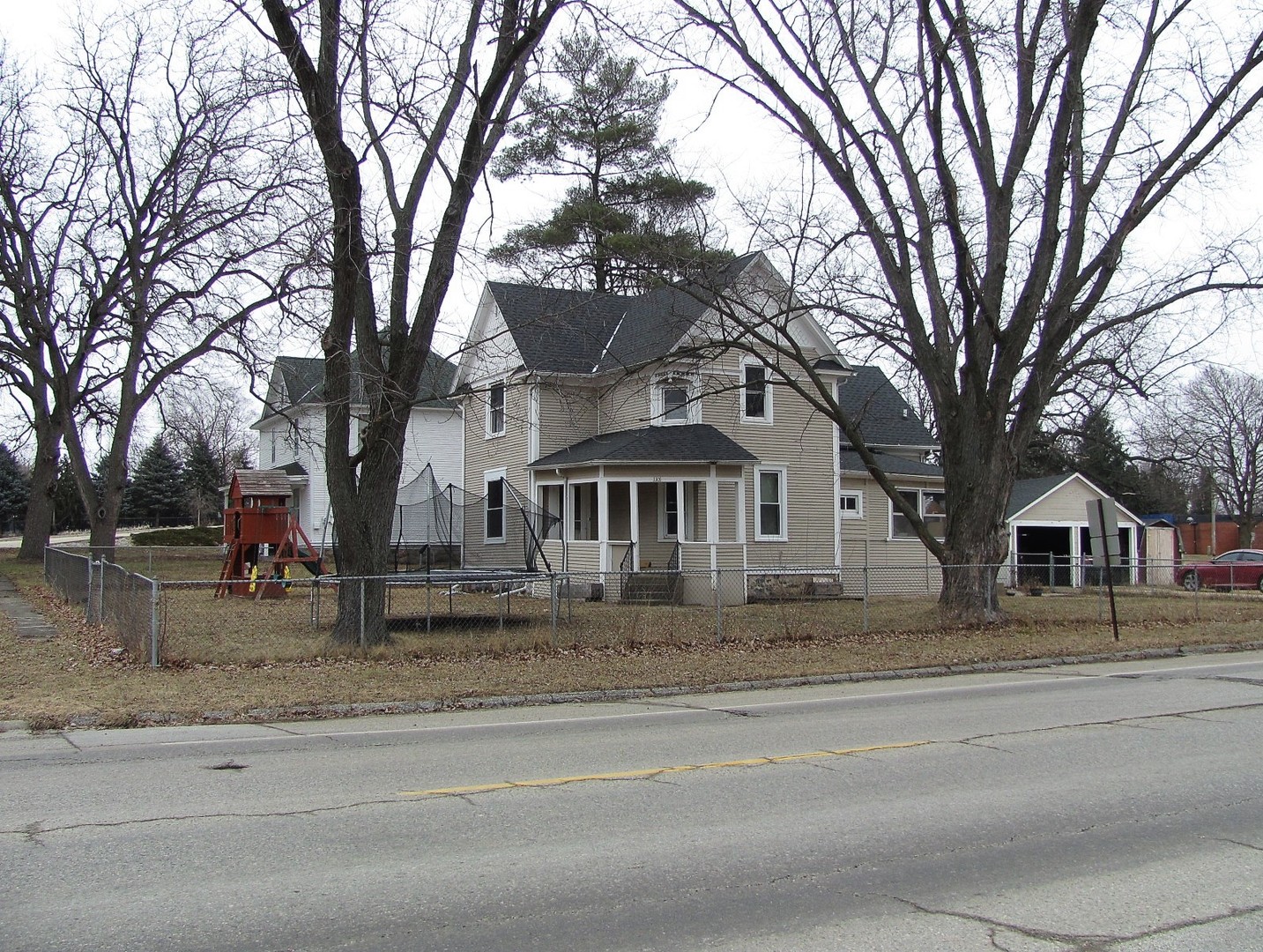 a front view of a house with trees