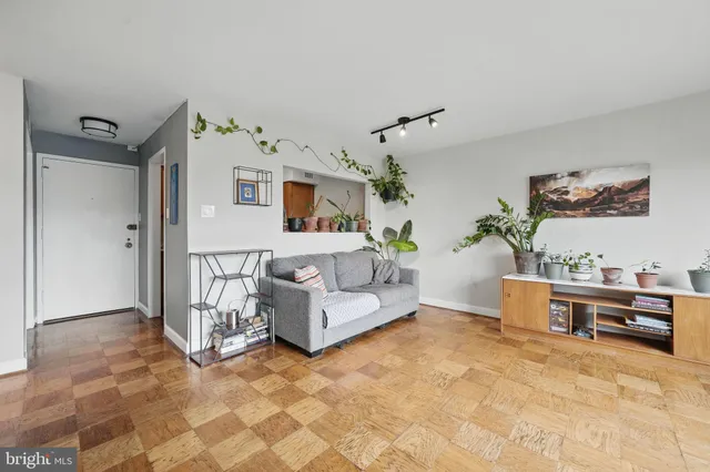 a living room with furniture and white walls