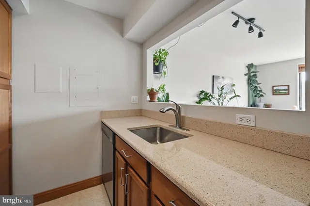 a kitchen with a sink and cabinets