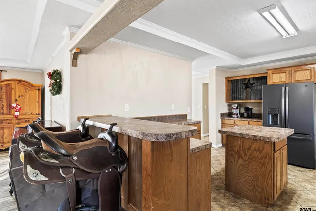 a kitchen with stainless steel appliances granite countertop a stove sink and cabinets