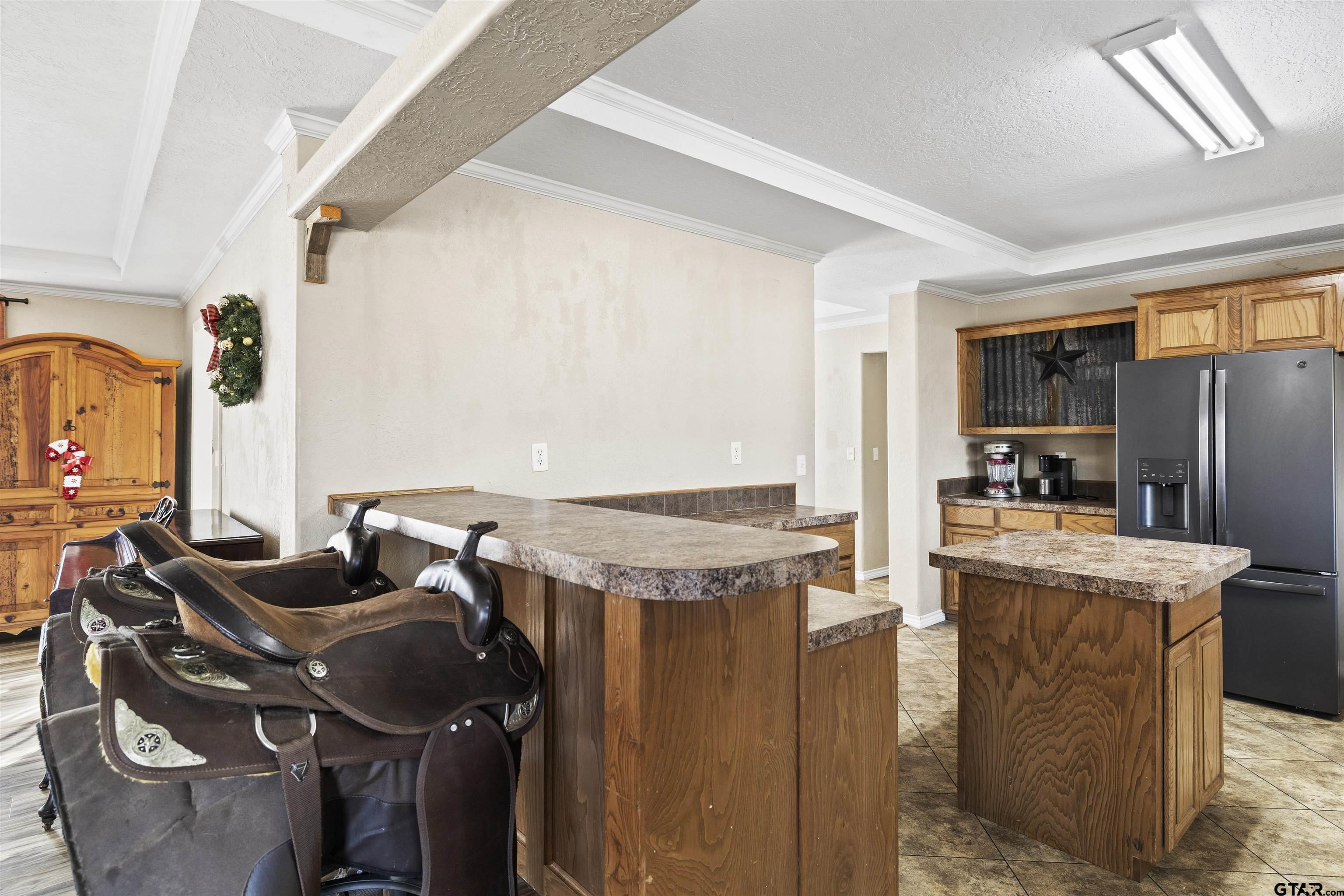 2089 Cottonwood Road Gilmer, TX 75645 - Photo 11 of 30 a open kitchen with stainless steel appliances granite countertop a stove and a refrigerator