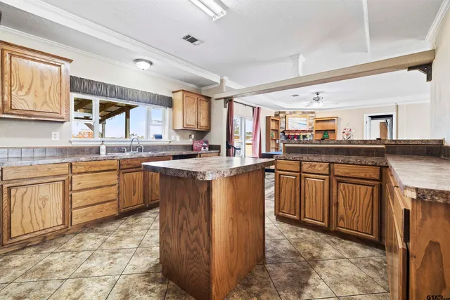 a bath tub sitting in a bathroom next to a window