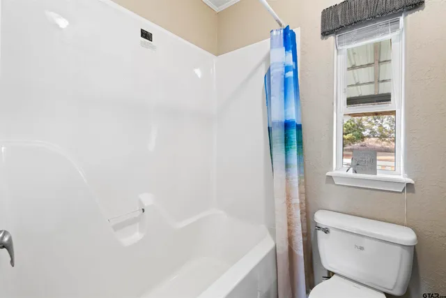 a bathroom with a double vanity sink a mirror and a shower