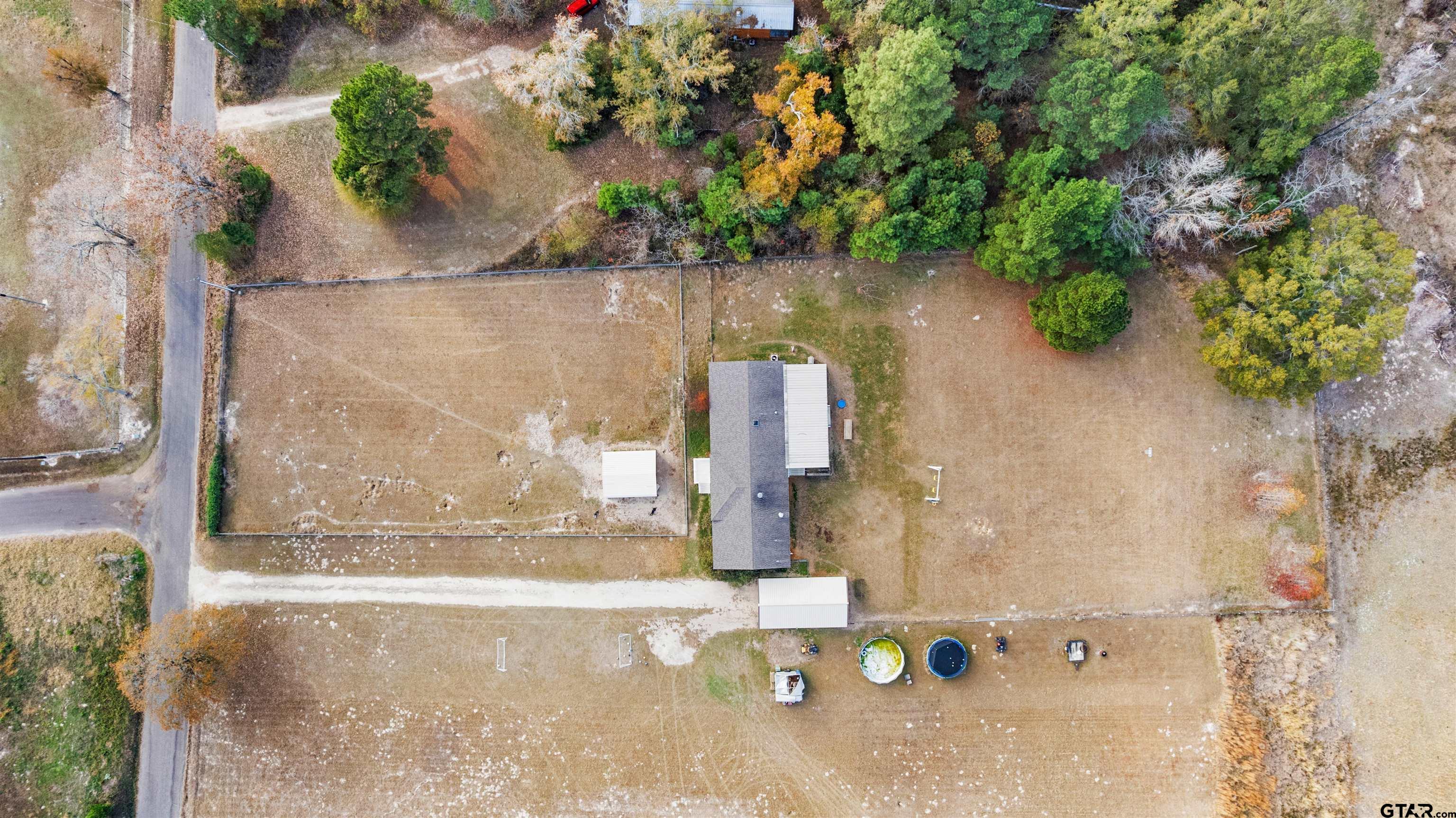 2089 Cottonwood Road Gilmer, TX 75645 - Photo 26 of 30 an aerial view of a house with a yard