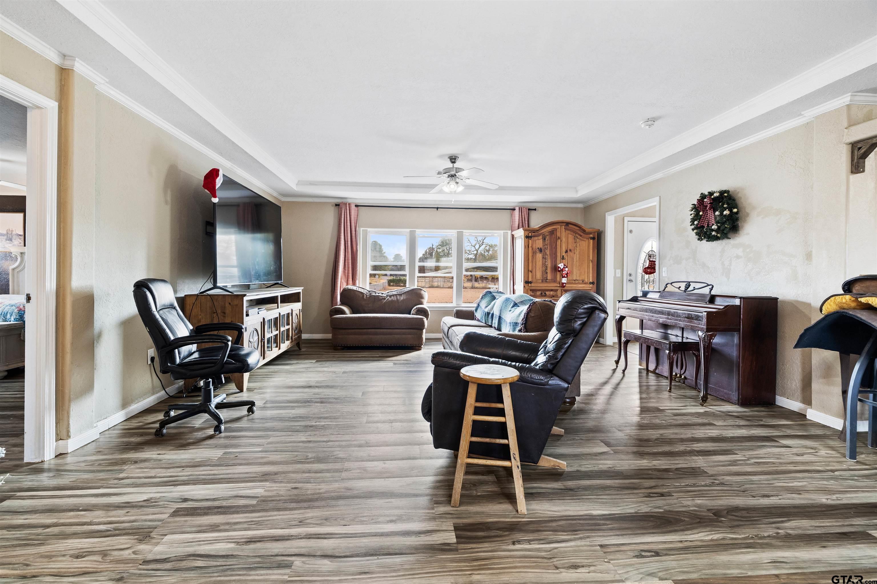2089 Cottonwood Road Gilmer, TX 75645 - Photo 5 of 30 a living room with furniture and a wooden floor