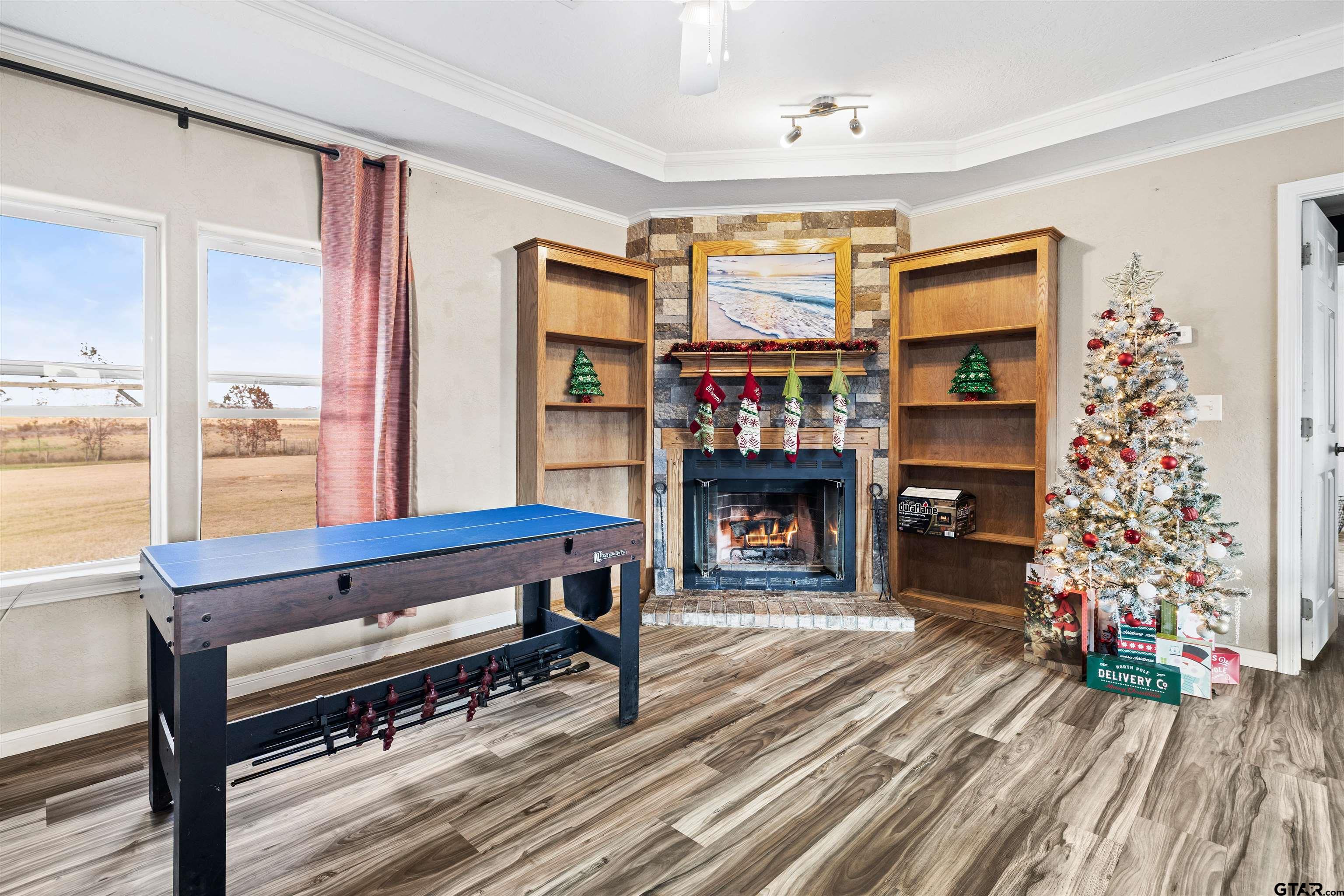 2089 Cottonwood Road Gilmer, TX 75645 - Photo 7 of 30 a living room with furniture a rug and a fireplace