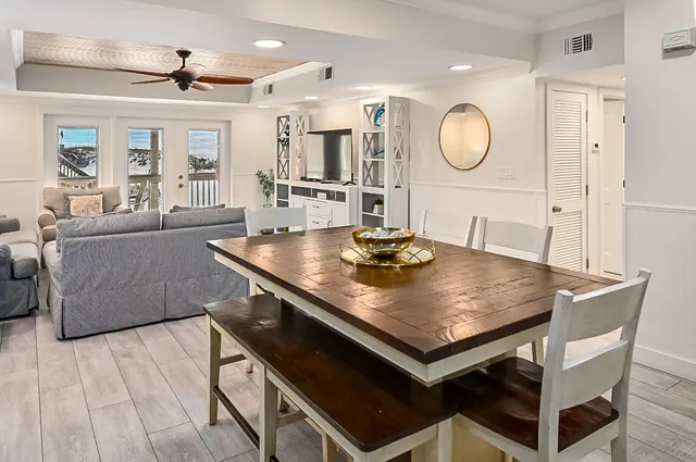 a living room with a table and chairs