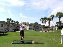 a roof deck with table and chairs