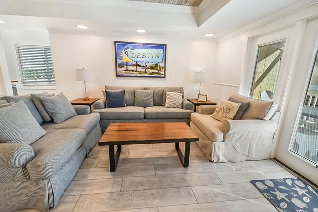 a living room with furniture and a rug