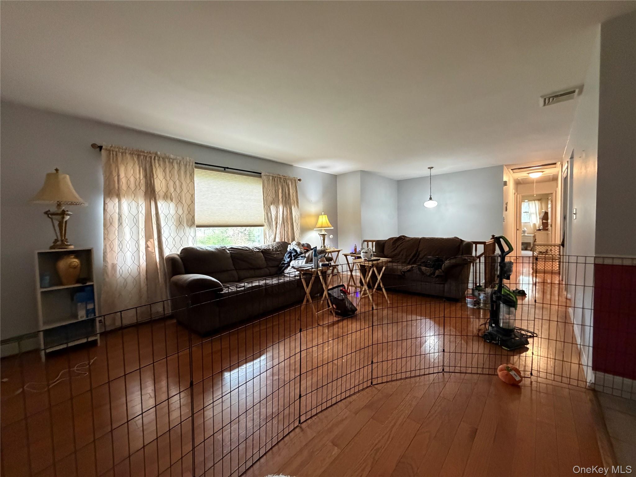 94 Booth Road Chester, NY 10918 - Photo 5 of 21 Spacious interior with hardwood flooring, platinum grey wall paint, and white trim