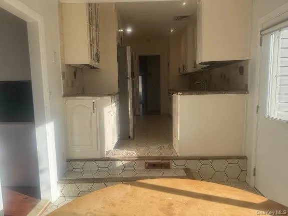 a bathroom with a sink a mirror and bathtub