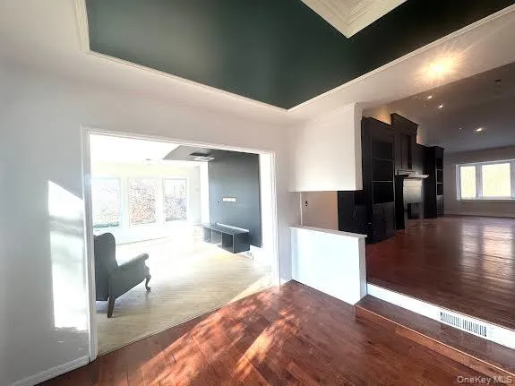 a view of a living room with hardwood floor