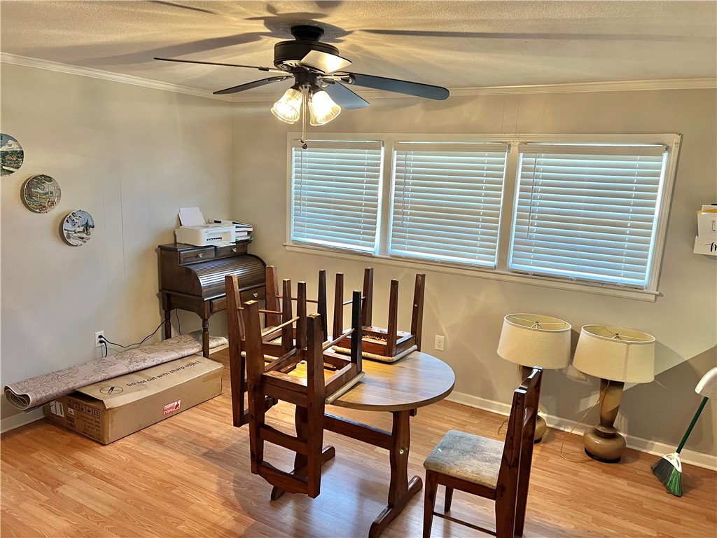 106 Donhill Road Anderson, SC 29625 - Photo 3 of 11 This versatile room features warm flooring and natural light, perfect for various uses.