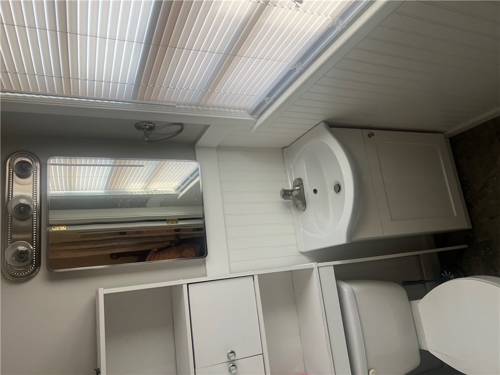 106 Donhill Road Anderson, SC 29625 - Photo 8 of 11 This bathroom features a contemporary vanity and practical storage solutions, creating a clean and functional space.