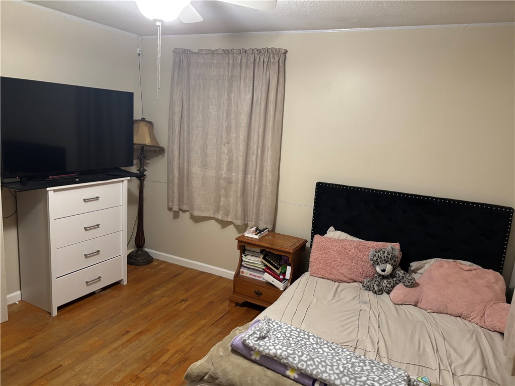 106 Donhill Road Anderson, SC 29625 - Photo 9 of 11 This cozy bedroom features warm wood flooring and a refreshing ceiling fan.
