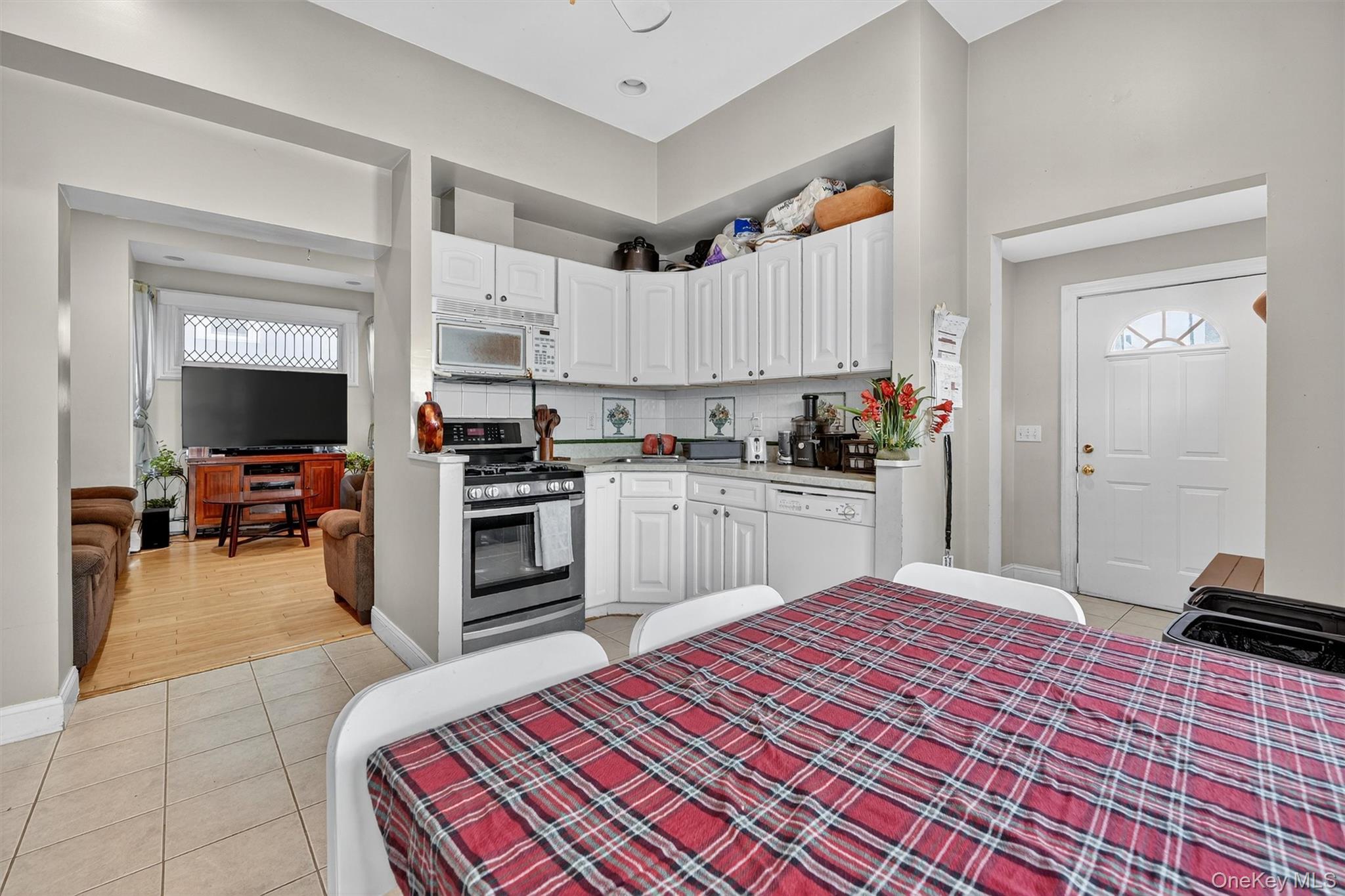 16 Maple Place Ossining, NY 10562 - Photo 12 of 45 a kitchen with kitchen island a sink stainless steel appliances and cabinets