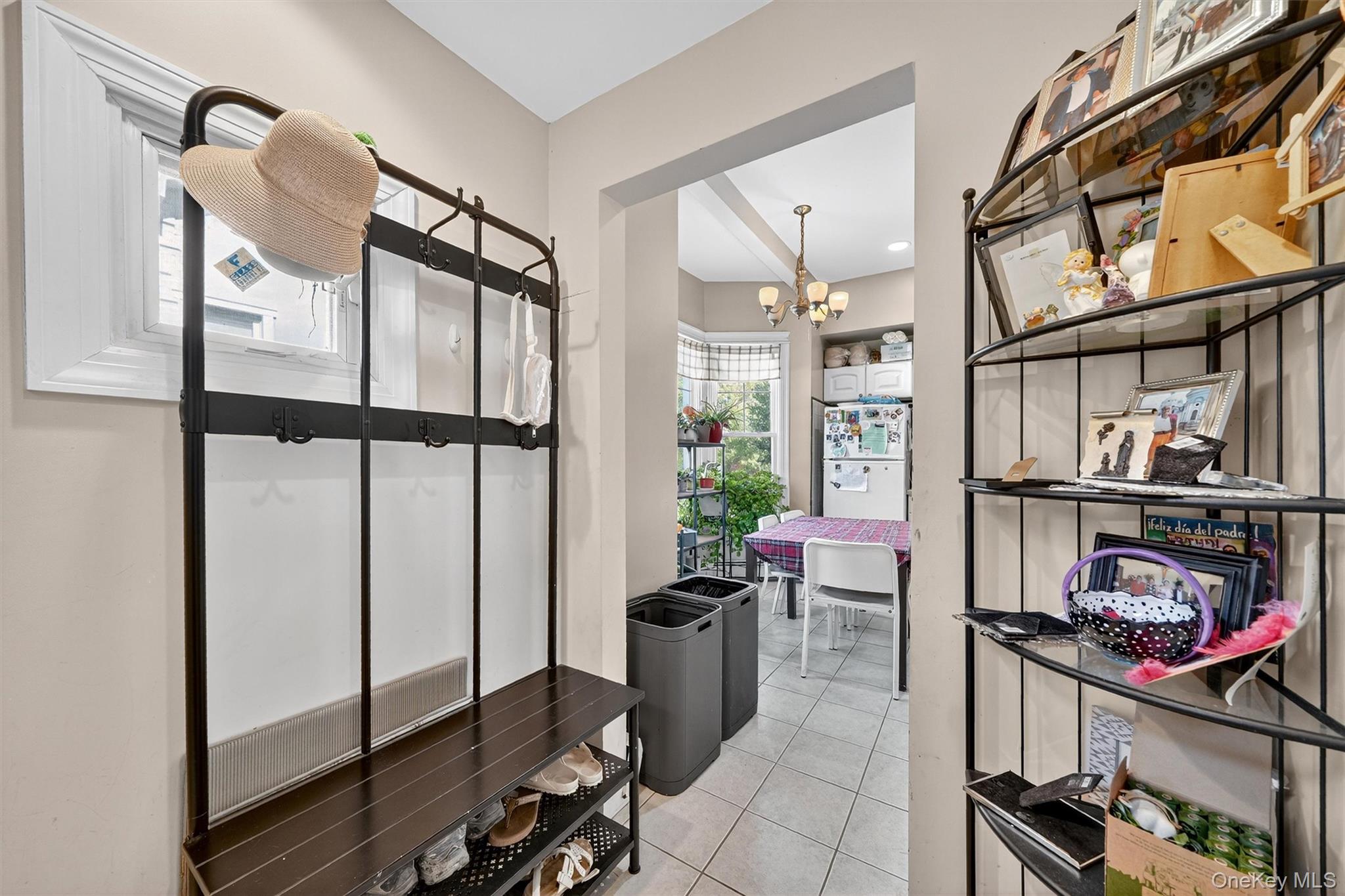 16 Maple Place Ossining, NY 10562 - Photo 13 of 45 a view of an entryway with a flower pot and a window